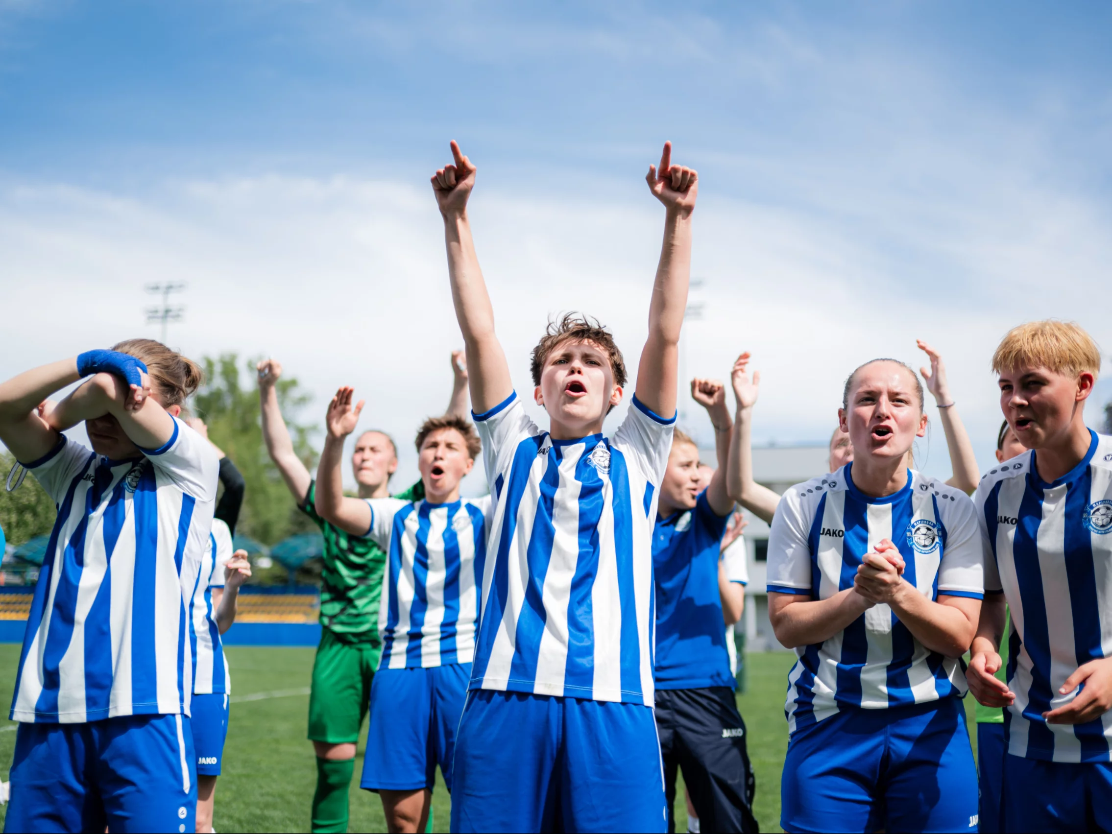 A vibrant array of soccer action shots and community engagement, illustrating the spirit of Women's Football Club Mariupol.